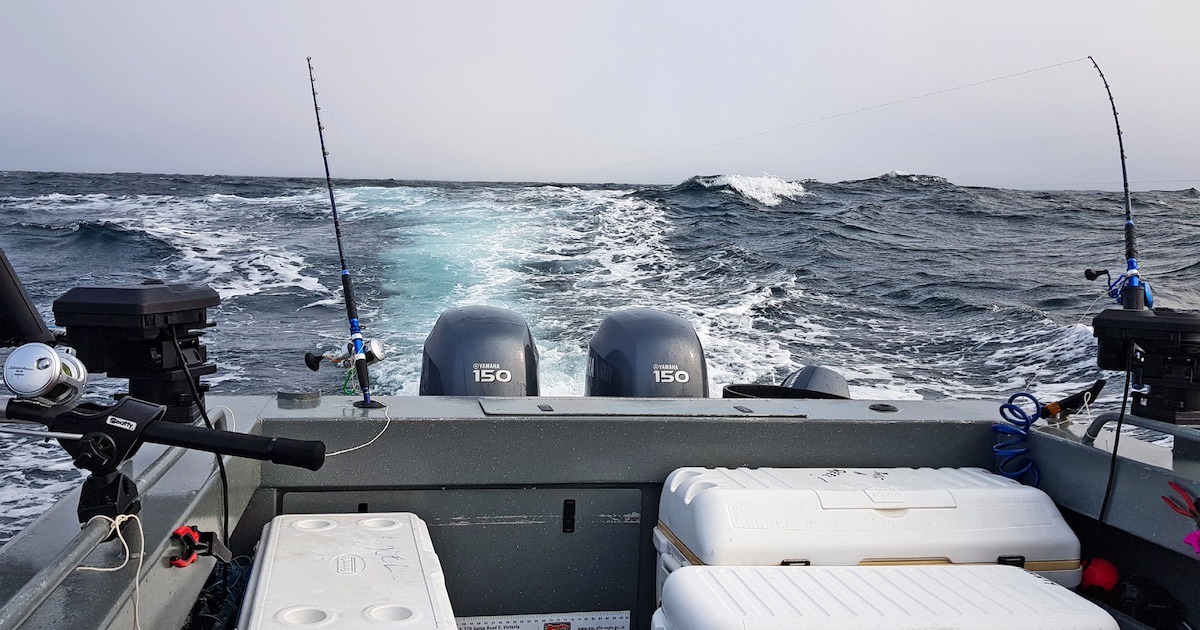 Fishing in the Pacific Ocean on a Boat with Fishing Rods Stock