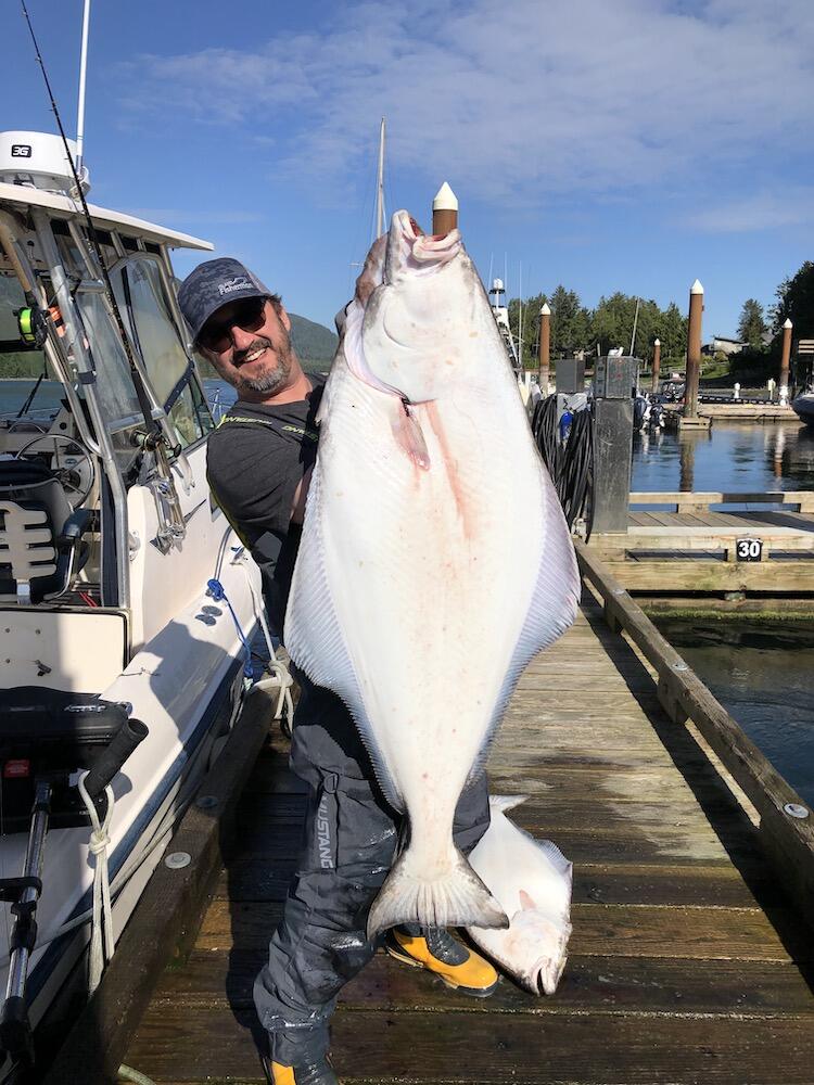 https://islandfishermanmagazine.com/wp-content/uploads/2021/04/Joel-Unickow-with-a-fresh-caught-halibut.jpg