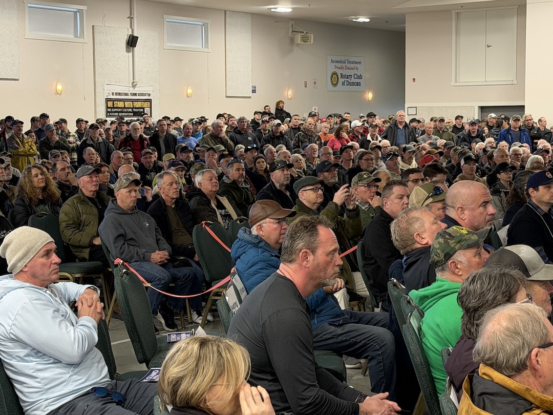 A capacity crowd of over 1,400 people seated in a large hall at the Cowichan Exhibition Park in Duncan, BC, for the BC Recreational Fishing Association town hall.