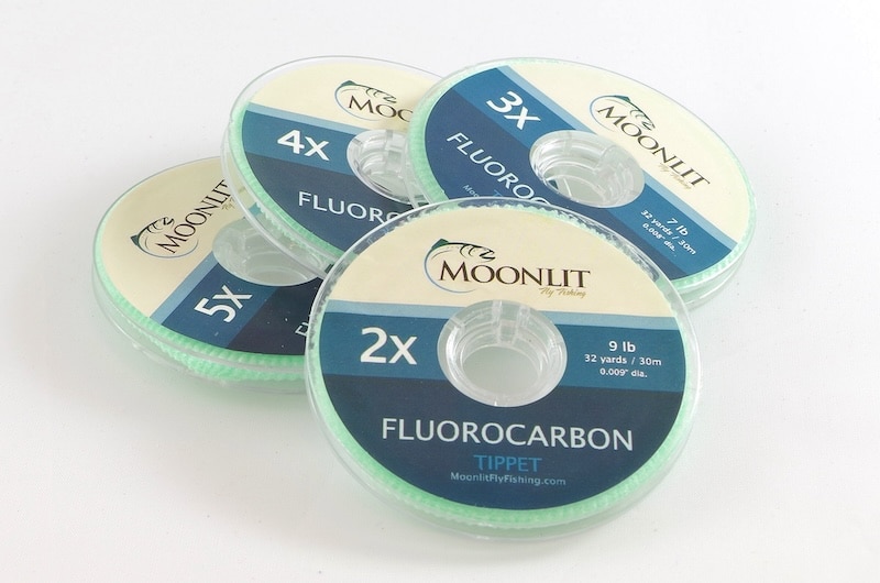 Moonlit Fly Fishing fluorocarbon tippet spools in 2x, 3x, 4x, and 5x sizes, featured in our Fly Fishing Gear Guide for matching leader diameter to target species.