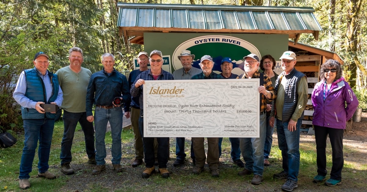 Volunteers at the Oyster River Enhancement Society hatchery accepting a check for Chinook Enhancement