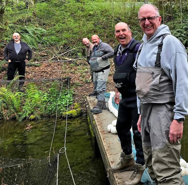 Chinook enhancement volunteers preparing to seine coho fry for release.