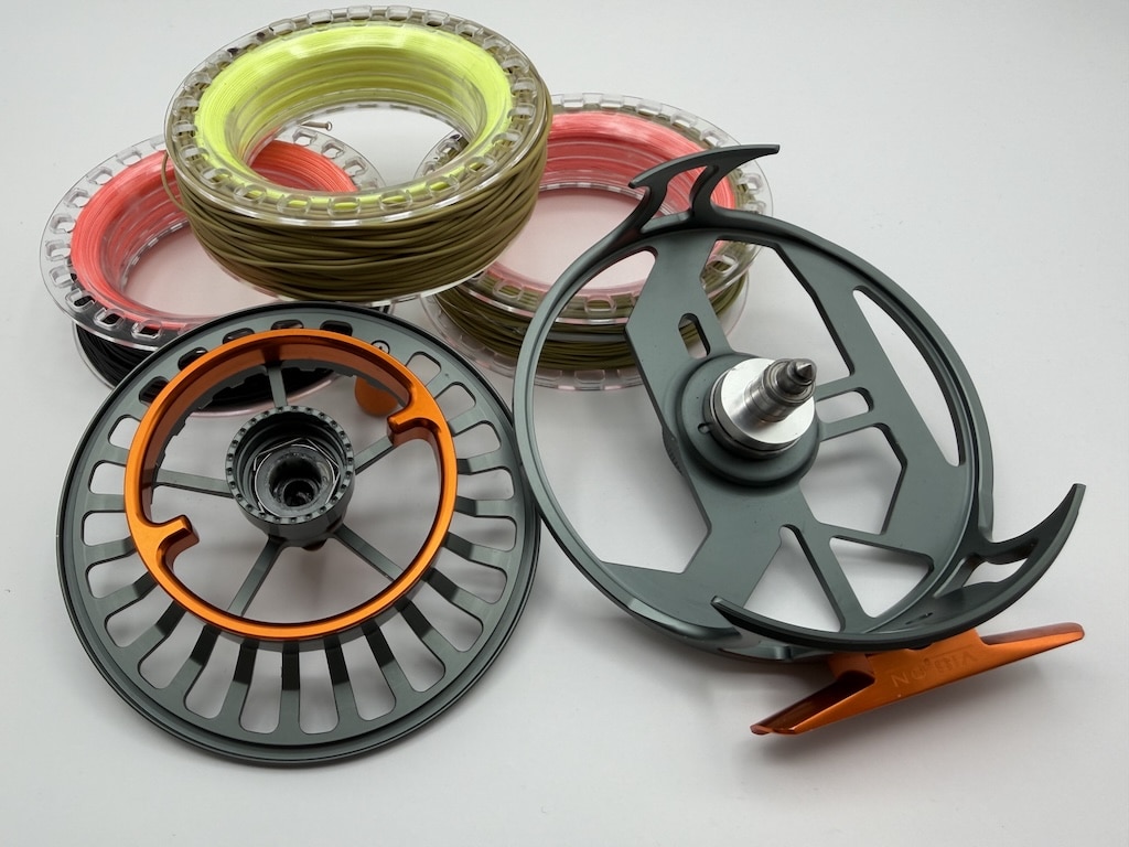 A Stillmaniac Review & Pilgrimage: Fly Fishing for Coastal Cutthroat Trout in Powell River Vision XLV Stillmaniac Cassette fly reel disassembled showing the large-arbor frame, spindle, and clear polycarbonate spools