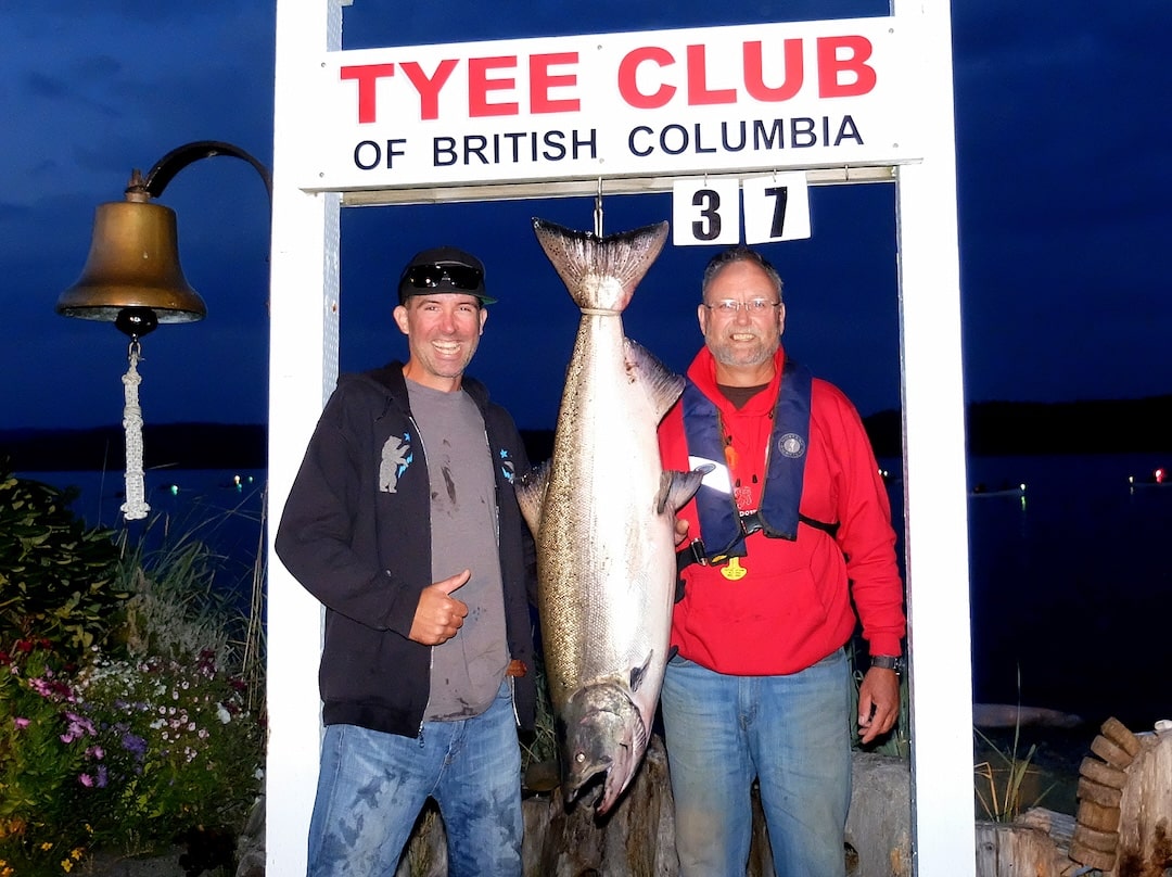 Blair Howell and guide Jeremy Maynard with a 37 lb hatchery Chinook salmon registered at night at the Tyee Club scale