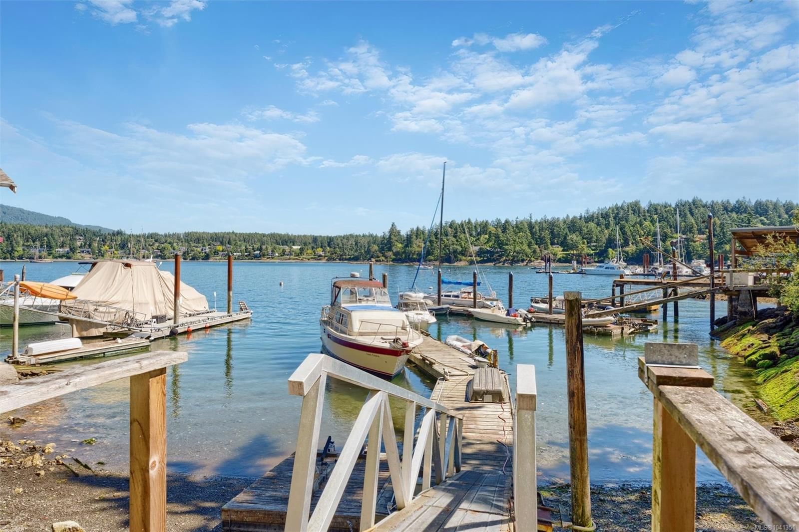 Coastal Luxury: 10968 Madrona Drive in Deep Cove Private marine ramp and deep-water boat dock setup in sheltered Deep Cove.