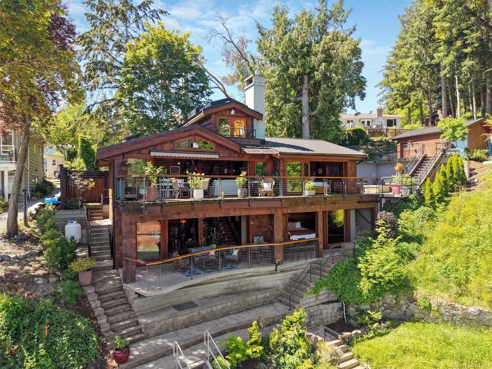 Coastal Luxury: 10968 Madrona Drive in Deep Cove Multi-level oceanfront exterior of the North Saanich waterfront property at 10968 Madrona Drive.