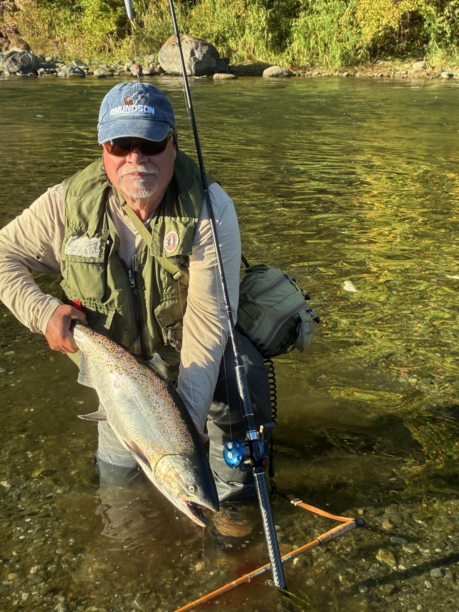 Somass River Salmon Fishing: Low-Water Tactics Angler holding a Somass River Chinook salmon landed on light tackle